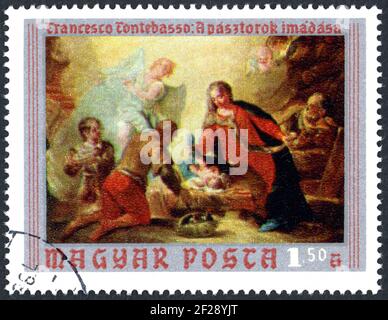 Un francobollo stampato in Ungheria, mostra i dipinti del Museo Cristiano, Esztergom: Adorazione dei Pastori, di Francesco Fontebasso, circa 1970 Foto Stock