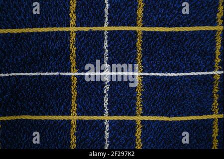 Tessuto blu scuro con strisce bianche gialle. Foto di alta qualità Foto Stock