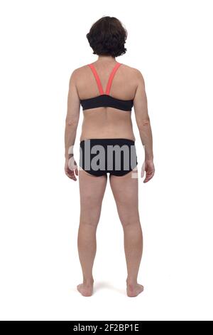 vista posteriore di una donna incinta con costume da bagno bianco sfondo Foto Stock