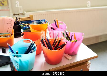 colorful school art supplies in a classroom Stock Photo