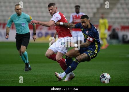 Reims, Marne, Francia. 12 marzo 2021. Lyon Striker MEMPHIS DEPAY in azione durante il campionato francese di calcio Ligue 1 Uber mangia Stade de Reims contro Olympique Lyonnais allo stadio Auguste Delaune - Reims.Drawn match 1:1 Credit: Pierre Stevenin/ZUMA Wire/Alamy Live News Foto Stock