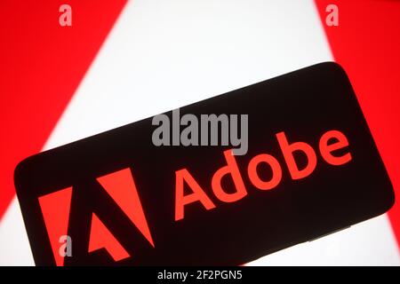 Ucraina. 10 marzo 2021. In questa illustrazione viene visualizzato un logo Adobe sullo schermo di uno smartphone. (Foto di Pavlo Gonchar/SOPA Images/Sipa USA) Credit: Sipa USA/Alamy Live News Foto Stock