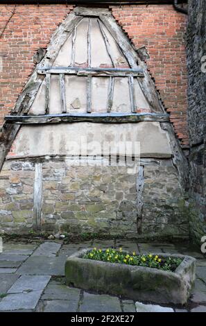 Sito di un ex cruck truss cottage in città Centro di Wirksworth nel Derbyshire Foto Stock