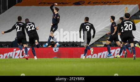 Londra, Regno Unito. 13 Marzo 2021. John Stones di Manchester City (3rd L) festeggia dopo aver segnato durante la partita della Premier League inglese tra Fulham e Manchester City al Craven Cottage di Londra, in Gran Bretagna, il 13 marzo 2021. Credit: Han Yan/Xinhua/Alamy Live News Foto Stock