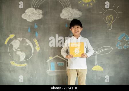 Ragazzo che ha un'icona SDG Foto Stock