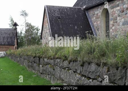 Svezia, Schweden; Città della Chiesa di Gammelstad; Kirchendorf; Chiesa di Nederluleå - frammento dell'edificio; Kościół z kamienia, kamienny mur Foto Stock