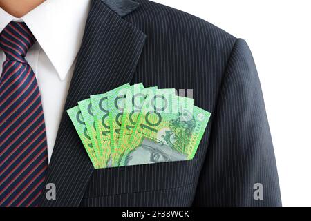 Denaro, banconote in dollari australiani (AUD), in tasca per tuta uomo d'affari Foto Stock