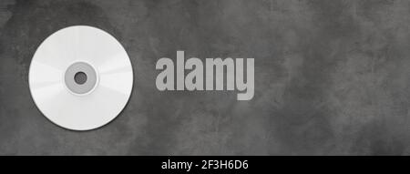 CD bianco - modello di mockup dell'etichetta DVD isolato in orizzontale banner in calcestruzzo Foto Stock