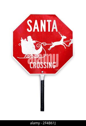 Santa crocevia segno con slitta e renne. Cartello di sosta a tema natalizio usato per il controllo del traffico attraversando le guardie. Foto Stock