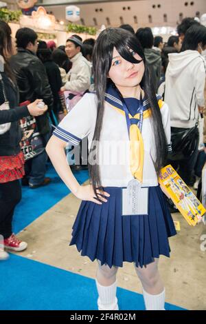 Donna giapponese vestita in studentessa, uniforme marinara, Tokyo International ANIME Fair, Giappone Foto Stock