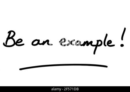 Siate un esempio! scritto a mano su sfondo bianco. Foto Stock
