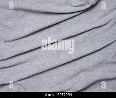 tessuto di cotone grigio chiazzato per abbigliamento, tessuto crespato, primo piano Foto Stock