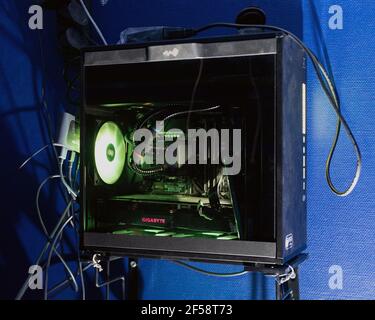 High performance server computer illuminated by internal LEDs inside. Computer with water cooling system. concept of eSports and gaming. Omsk, Russia, Stock Photo