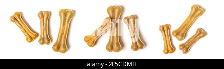 Osso per cani isolato su sfondo bianco Vista dall'alto piatto Lay Delicious Treat per il tuo amato animale domestico Food for Animals Concept Banner collage. Foto Stock