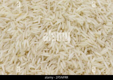 riso bianco dettaglio trama sfondo, primo piano dello sfondo del riso Foto Stock