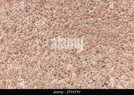 Pietre piccole in calcestruzzo lastra superficie parete texture sfondo. Foto Stock