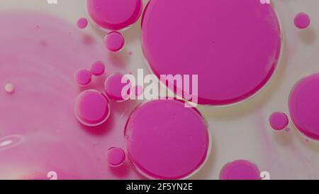 Fantastica struttura di coloratissima vernice ad olio e bolle d'inchiostro, movimento caotico, pittura astratta e colorata Foto Stock