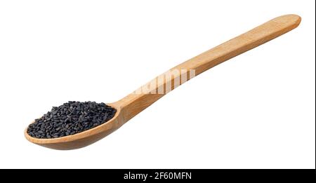 asciugare i semi di sesamo nero in un cucchiaio di legno Foto Stock
