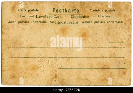 Cartolina di carta colorata antica con avvisi in varie lingue Foto Stock