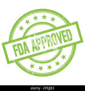 Testo APPROVATO dalla FDA scritto su un francobollo in gomma verde rotondo vintage. Foto Stock