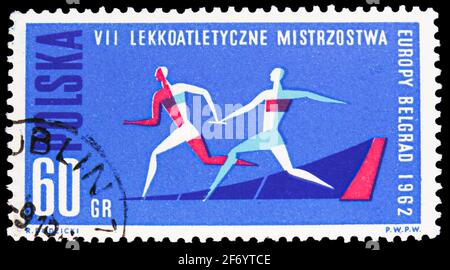 MOSCA, RUSSIA - 18 GENNAIO 2021: Francobollo stampato in Polonia mostra Relay Race, 7° Campionato europeo di atletica serie, circa 1962 Foto Stock