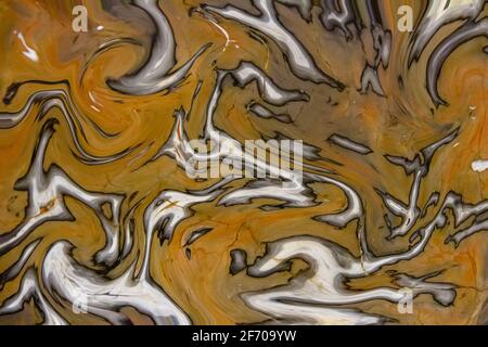 Sfondo ornamentale con motivi astratti in un colore beige dominante. Pittura liquida texture astratta, tecnica d'arte. Foto Stock