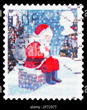 MOSCA, RUSSIA - 28 FEBBRAIO 2021: Francobollo stampato nel Regno Unito mostra Padre Natale S/A, serie di Natale, circa 2006 Foto Stock