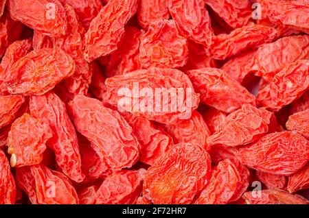 Sfondo di frutti di bosco cinesi secchi o bacche di goji. Foto Stock