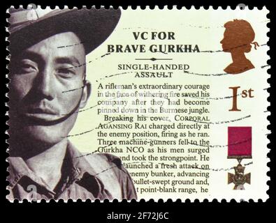 MOSCA, RUSSIA - 22 DICEMBRE 2020: Francobollo stampato nel Regno Unito mostra Corporal Agansing Rai, 150° anniversario della serie Victoria Cross Foto Stock