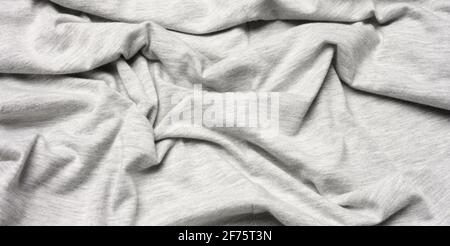 tessuto di cotone grigio chiazzato per abbigliamento, tessuto crespato, primo piano Foto Stock