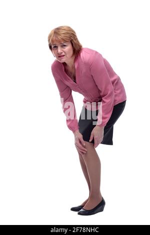Donna di mezza età che soffre di dolore al ginocchio, lesioni alle articolazioni o artrite Foto Stock