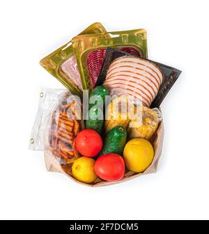 Un set di prodotti in una borsa kraft avvolta. Vista dall'alto. Il concetto di acquistare cibo. Foto Stock