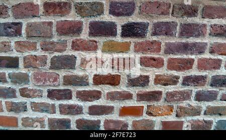 Colorato Brick e sfondo di tessitura di pietra, castello di Wawel, Cracovia in Polonia, Europa. Foto Stock