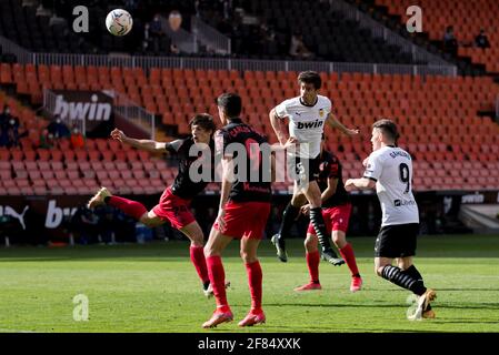 Valencia, Spagna. 11 Apr 2021. Gabriel Paulista, Kevin Gameiro di Valencia CF e Robin le Normand, Carlos Fernandez Luna di Real Sociedad in azione durante la partita di calcio spagnola la Liga tra Real Sociedad e Valencia CF allo stadio di Mestalla.Punteggio finale; Valencia CF 2:2 Real Sociedad. (Foto di Xisco Navarro/SOPA Images/Sipa USA) Credit: Sipa USA/Alamy Live News Foto Stock