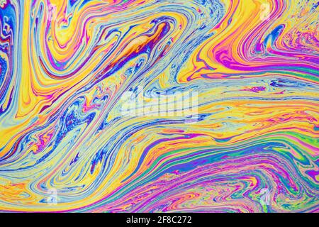 Sfondo dei modelli policromi psichedelici. Foto macro di bolle di sapone Foto Stock