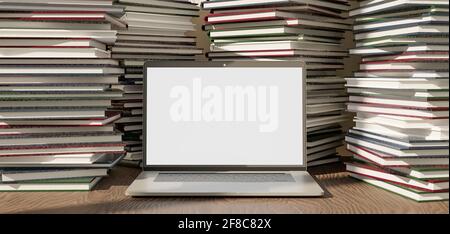 mockup di laptop pieno di mucchi di libri intorno Foto Stock