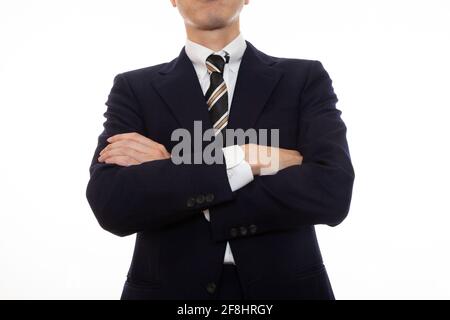 Una persona d'affari dignitosa con le braccia piegate Foto Stock