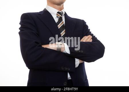 Una persona d'affari dignitosa con le braccia piegate Foto Stock