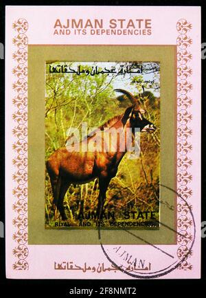 MOSCA, RUSSIA - 30 SETTEMBRE 2019: Francobollo stampato in Ajman Shows Block: Roan Antipe (Hippotragus equinus), mammiferi serie, circa 1973 Foto Stock