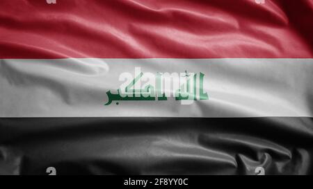 Bandiera irachena che svanisce nel vento. Primo piano di bandiera irachena soffia, seta morbida e liscia. Tessuto tessuto tessuto tessitura segno sfondo Foto Stock