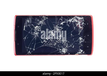 Marca non identificata di telefono cellulare con schermo rotto. Vecchio gadget dello schermo a sfioramento utilizzato Foto Stock