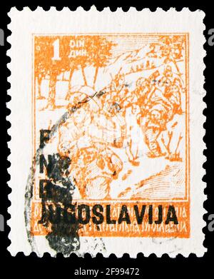 MOSCA, RUSSIA - 4 NOVEMBRE 2019: Francobollo stampato in Jugoslavia mostra partisani il marzo, francobolli 1945-1947 overprinted serie, circa 1950 Foto Stock