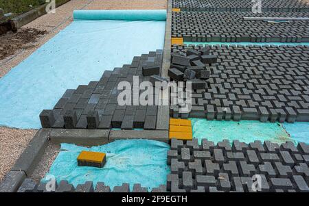 Cataste di pietre ad incastro per installazione passo carraio landscaping Foto Stock