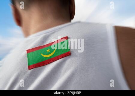 Bandiera nazionale della Mauritania sulla schiena dell'atleta Foto Stock