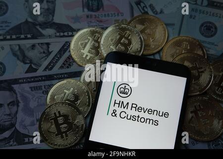 HMRC HM ricavi e dogane. Bitcoins e dollari. Foto Stock