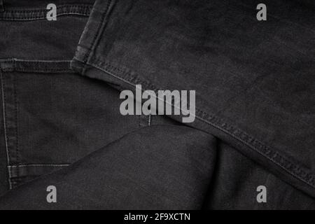 Nuovissimi jeans neri. Jeans macro texture sfondo Foto Stock