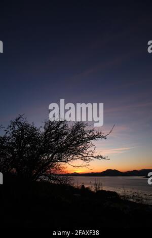 Tramonto sulla costa occidentale del Galles, Regno Unito Foto Stock