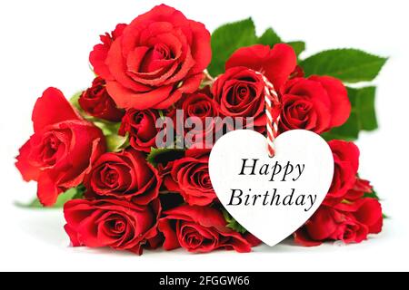 Belle rose rosse e cuore bianco. Felice biglietto di auguri di compleanno con fiori Foto Stock