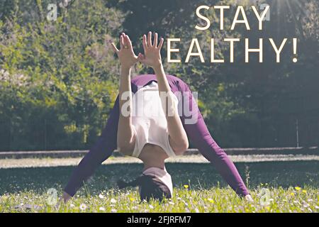 Donna in posizione di supporto con il testo 'Say Healthy' Foto Stock