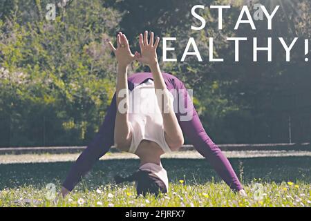 Donna in posizione di supporto con il testo 'Say Healthy' Foto Stock